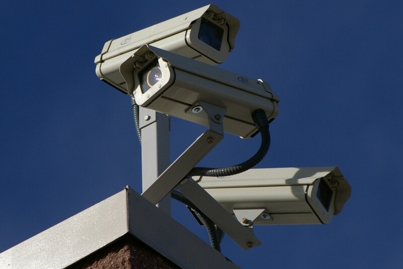 Surveillance cameras on the corner of a building